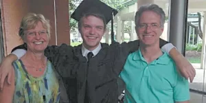 A sober teenager with his parents.